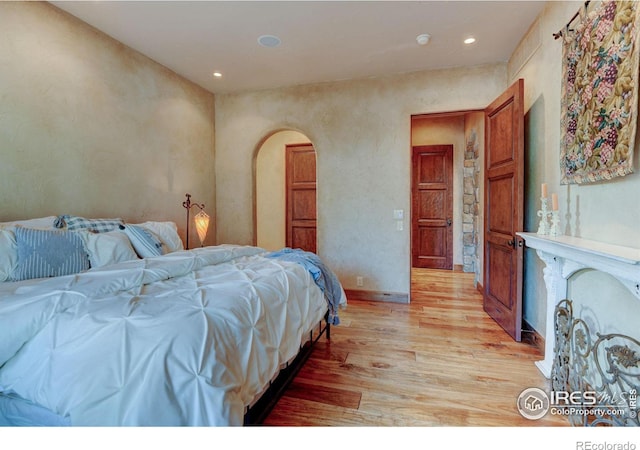 bedroom with light hardwood / wood-style floors