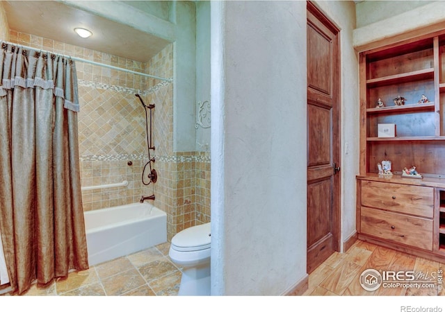 bathroom with shower / bath combo and toilet