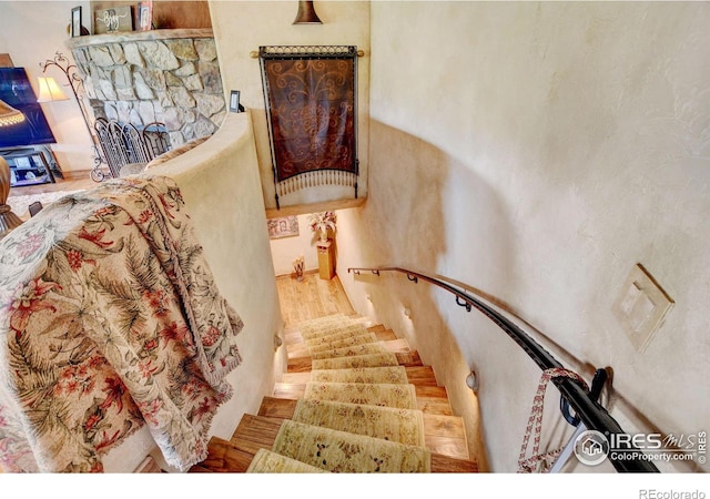 staircase featuring hardwood / wood-style flooring