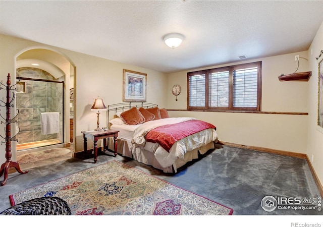 carpeted bedroom featuring a textured ceiling