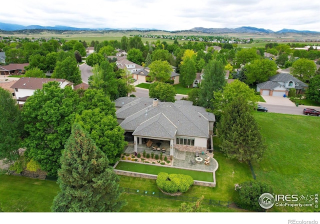 birds eye view of property featuring a mountain view