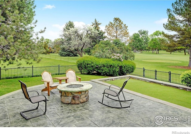 view of patio / terrace featuring an outdoor fire pit