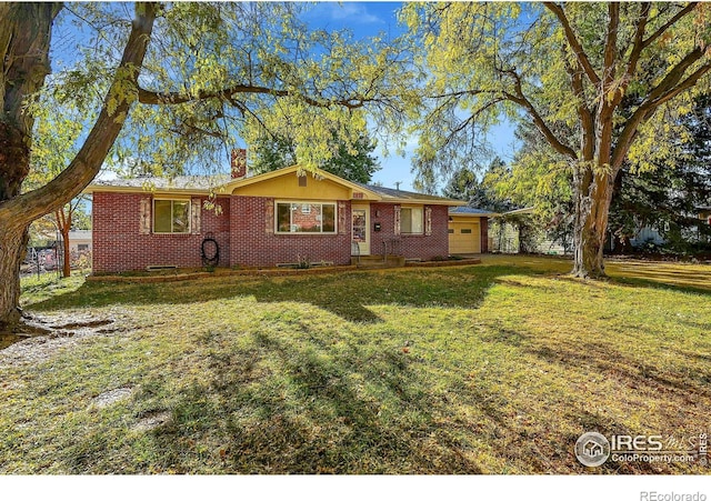 ranch-style house with a garage and a front yard