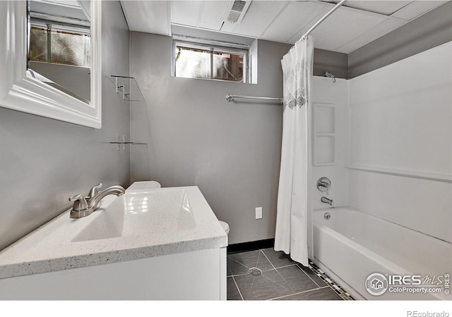 full bathroom featuring tile patterned floors, vanity, toilet, and shower / tub combo