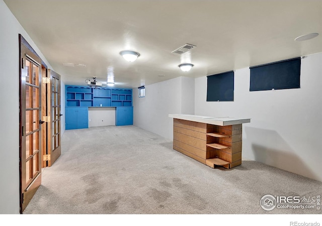 basement featuring carpet flooring