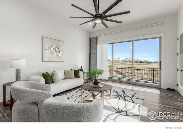 living room with hardwood / wood-style flooring and ceiling fan