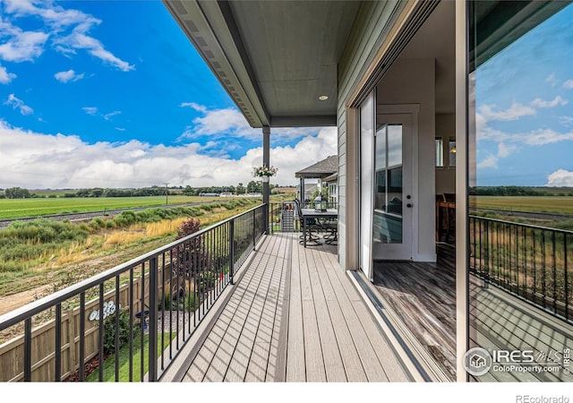 balcony featuring a rural view