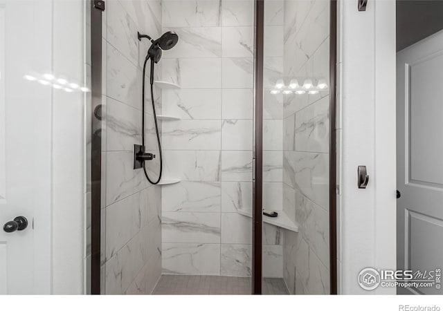 bathroom with a tile shower