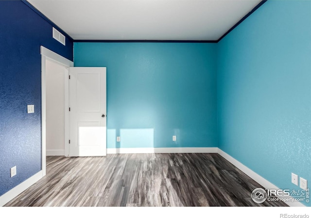 empty room featuring hardwood / wood-style flooring