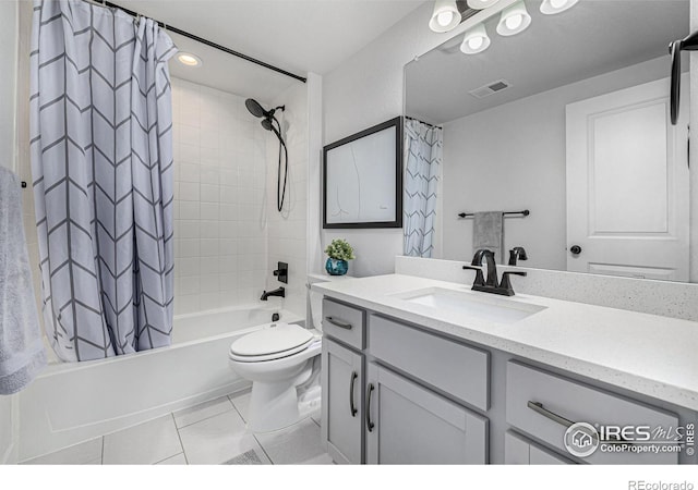 full bathroom with toilet, shower / tub combo with curtain, vanity, and tile patterned flooring