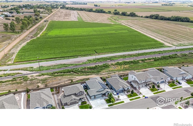 birds eye view of property with a rural view