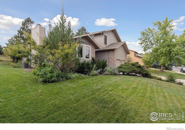 view of front of property featuring a chimney and a front yard