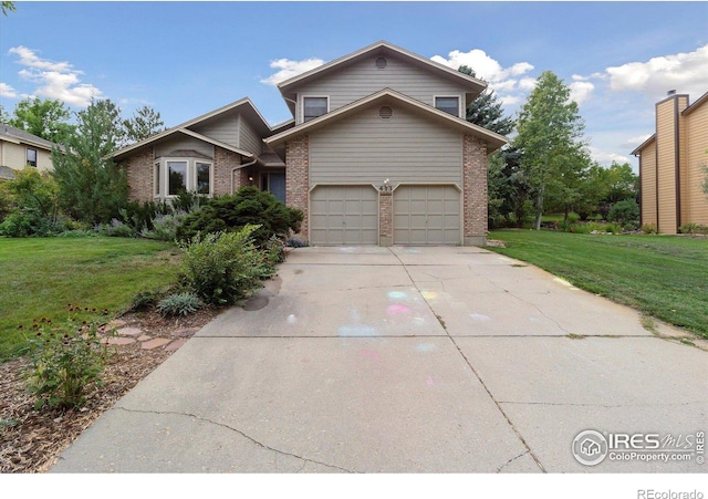 front of property featuring a front yard and a garage