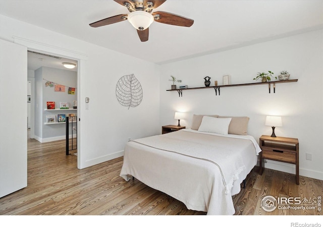 bedroom featuring ceiling fan and hardwood / wood-style flooring