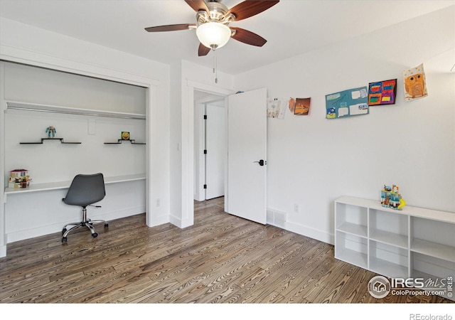 office space featuring hardwood / wood-style flooring and ceiling fan