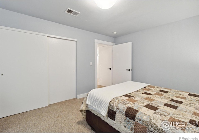 bedroom featuring a closet and carpet