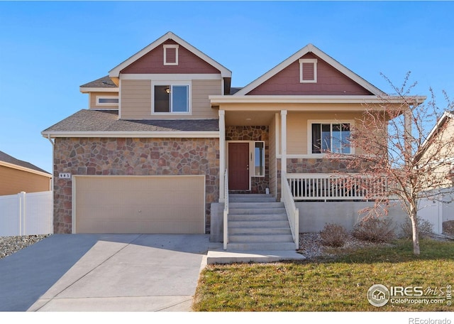 view of front of property featuring a porch and a garage