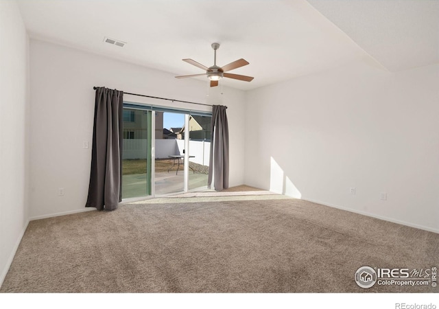 spare room featuring carpet and ceiling fan