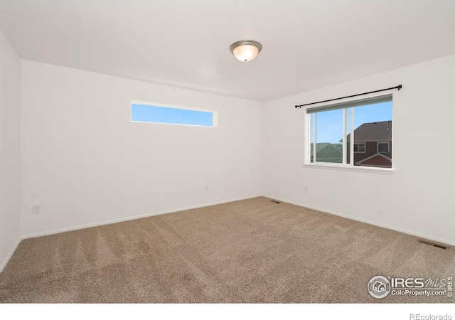 unfurnished room featuring carpet floors