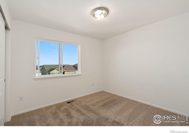 view of carpeted spare room