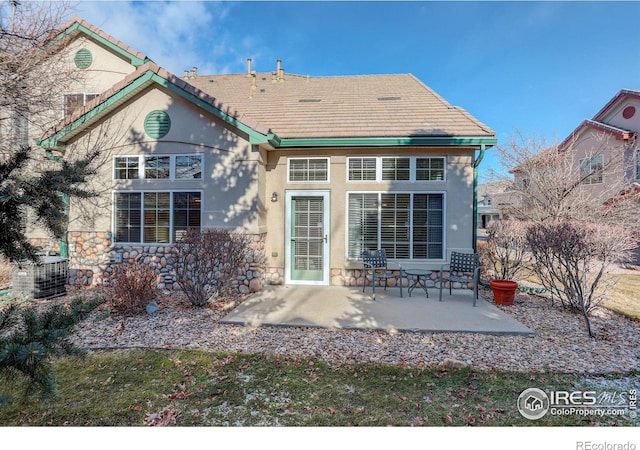 back of house featuring a patio and central AC unit