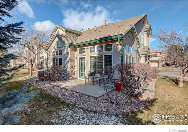 rear view of house featuring a patio area