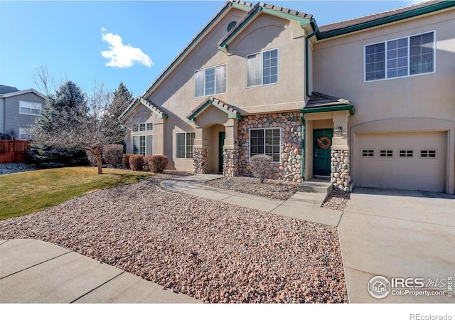 view of front of house with a front lawn and a garage