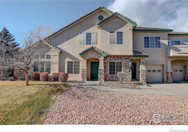 view of front of property with a front yard and a garage