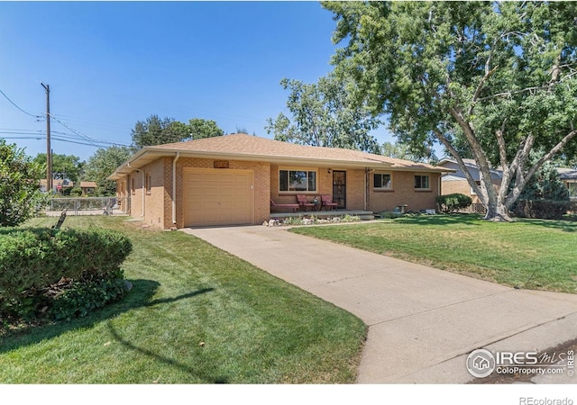 ranch-style house with a garage and a front yard