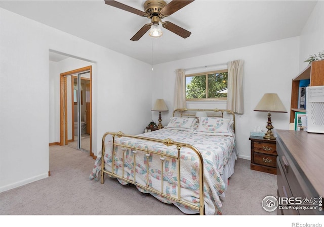 carpeted bedroom with ceiling fan and a closet