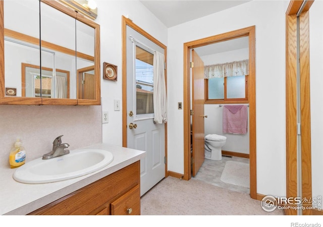 bathroom with vanity and toilet