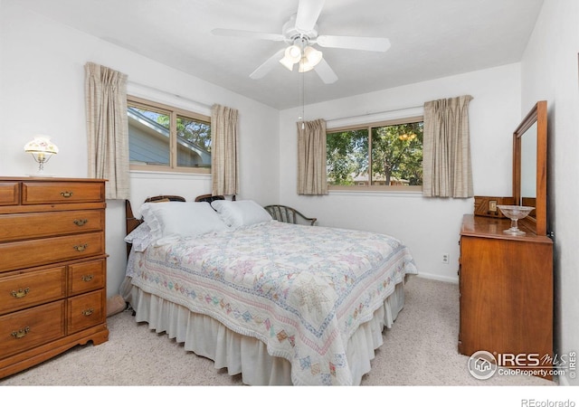 carpeted bedroom with ceiling fan