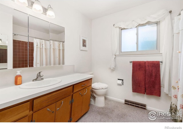 bathroom featuring a shower with curtain, vanity, and toilet