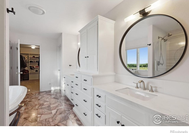 bathroom featuring vanity and walk in shower