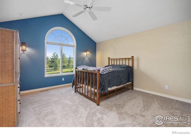 carpeted bedroom featuring vaulted ceiling and ceiling fan