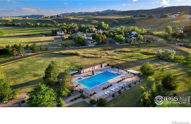 bird's eye view featuring a mountain view and a rural view