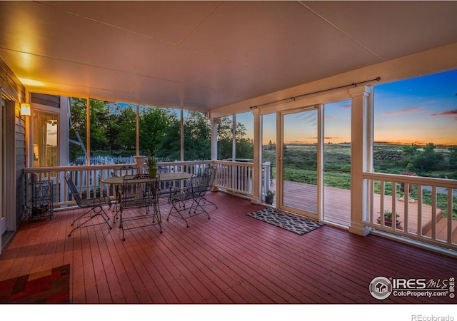 unfurnished sunroom with a healthy amount of sunlight