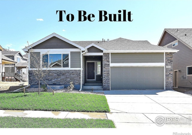 view of front of property featuring a garage and a front lawn