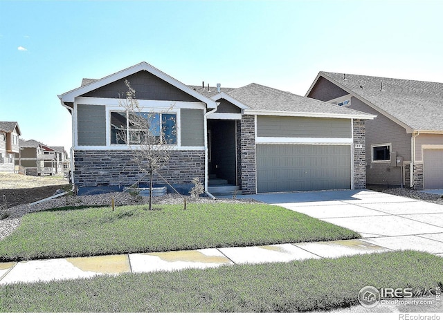 view of front facade with a front yard and a garage