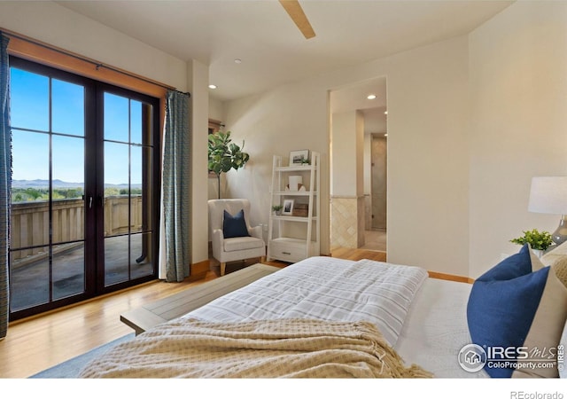 bedroom with light hardwood / wood-style flooring, access to outside, and french doors