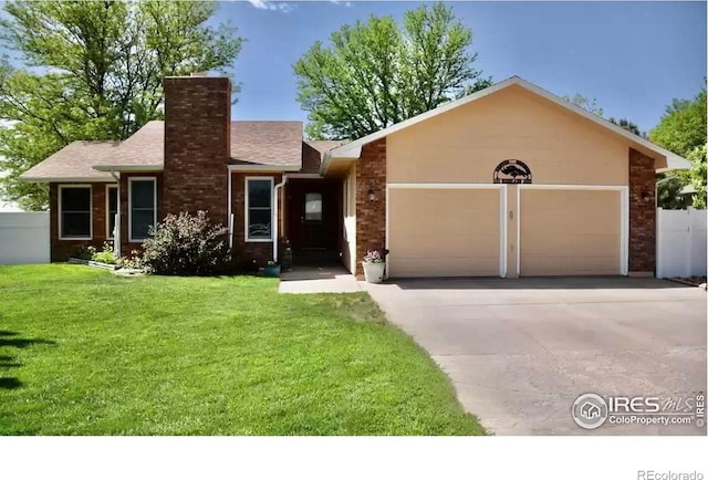 ranch-style home featuring a garage and a front yard