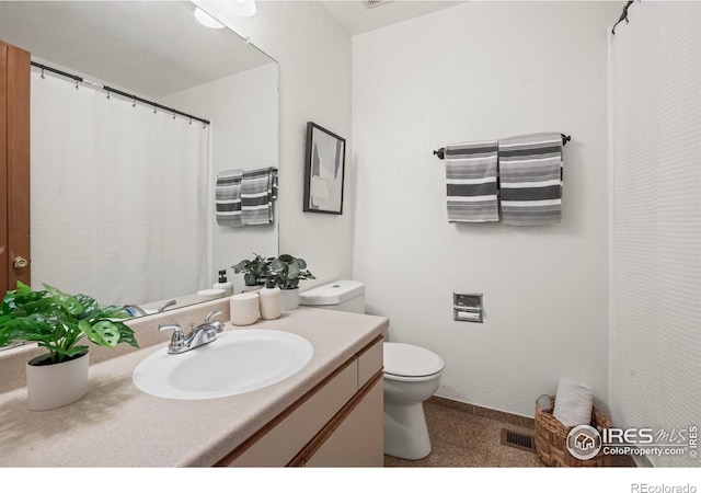 bathroom with vanity and toilet