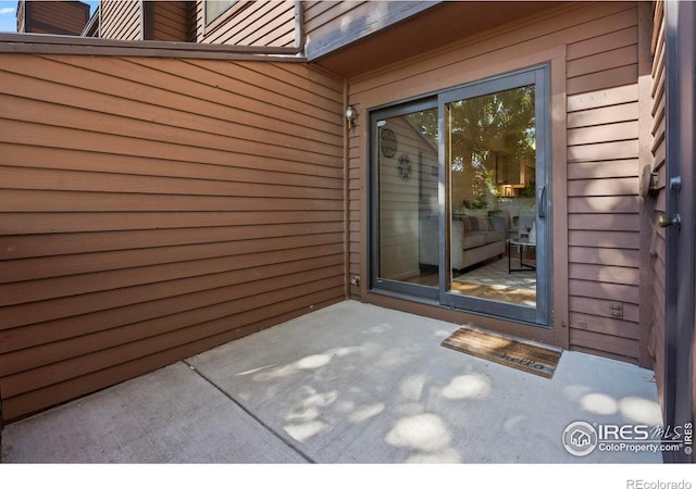 doorway to property with a patio area