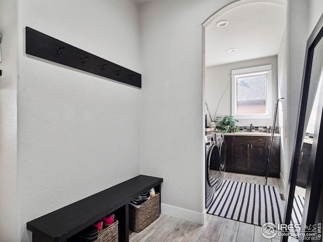 interior space with washing machine and dryer and sink