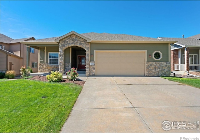 view of front of property with a garage and a front yard