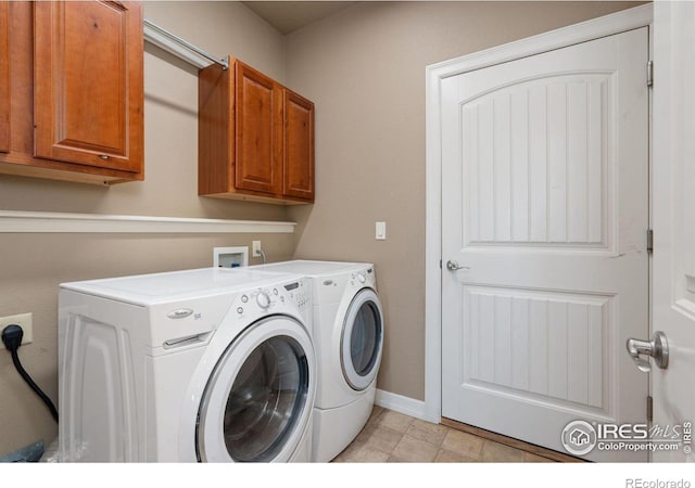 laundry area featuring cabinets and separate washer and dryer