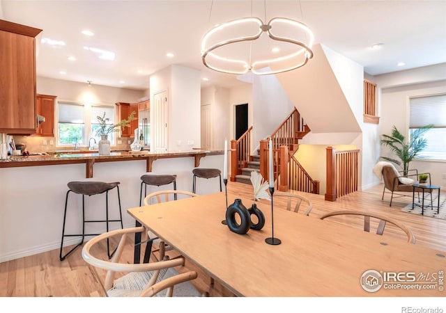 dining space featuring light wood-type flooring