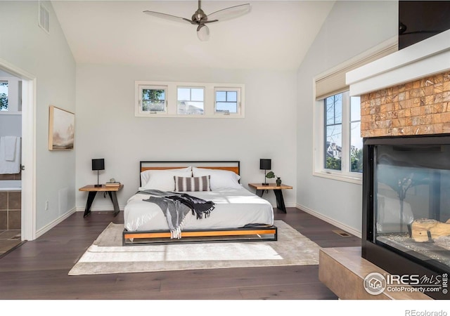 bedroom featuring ceiling fan, dark hardwood / wood-style flooring, and lofted ceiling