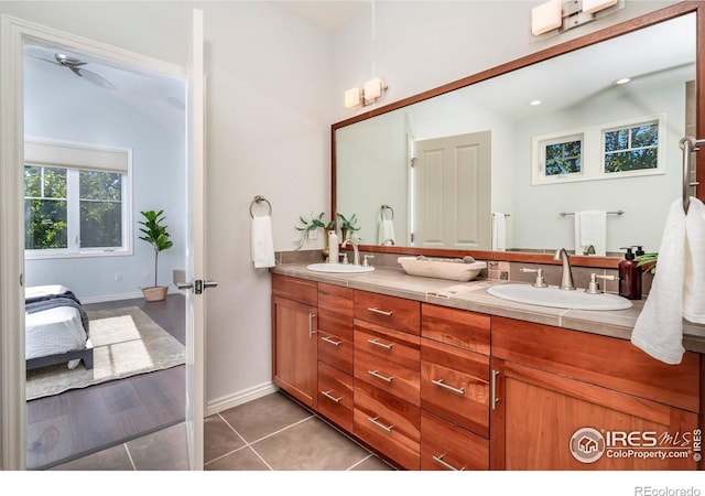 bathroom featuring tile patterned floors, ceiling fan, and vanity