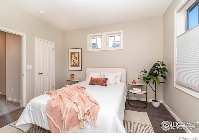 bedroom featuring dark hardwood / wood-style floors